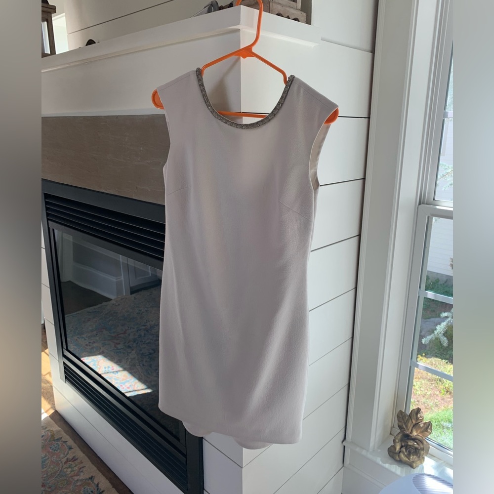 Trina Turk cream color dress with jeweled neckline. Size 0.